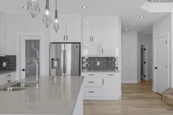 White Kitchen Cabinets in Place Chaleureuse