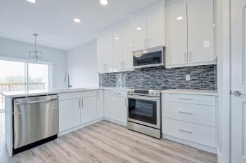 White Kitchen Cabinets with White Countertops in Starling