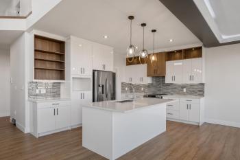 White Kitchen Cabinets with White Countertops in Glenridding